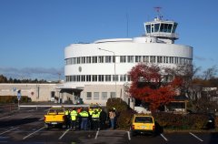 Airport personnel having a meeting outdoors